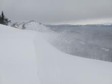 Intense blowing snow and cornice formation near the summit of Hidden Peak