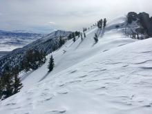 Wind texture snow in the foreground with small wind slabs developing on the opposite slope