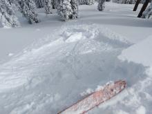 Cornice drop on a test slope that did not trigger any slab instabilities but did cause a sluff.