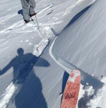 Skier cracking on a low angle slope wind-loaded by NE winds and previously undercut by the skin track.
