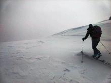 Wind affected slope on the windward side of a ridge.