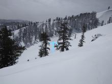 Old avalanche debris below NE-E aspect wind loaded terrain, likely from natural wind slab on March 6.