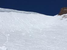 Small loose wet avalanches on gully feature just below 9000' at noon. 