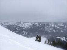 Clouds moving in and strong SW winds blowing snow. 