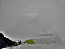 Ski kick triggered loose wet sluff on a steep test slope.