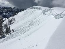 Cornice collapses that triggered loose wet avalanches and a slab failure