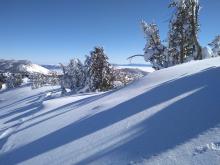 Minor amounts of drifting snow with soon to be cracked wind pillow near old track.