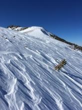 Exposed upper ridges showed evidence of recent winds.