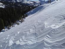 Shooting cracks through lower angle terrain connecting the 2 steeper avalanche paths.