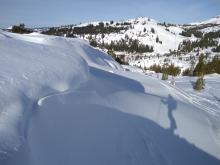 Soft wind slabs lower on the peak.