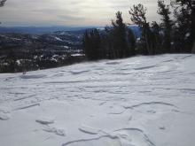 Minor blowing snow with more downslope saltation than slab deposition at 9,700'.