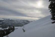 Leeward shoulder of a windy ridge.