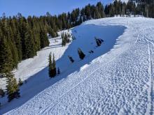 Wind scoured scalloped firm snow on an E-NE aspect.