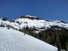 Decent snowcover holding on S to SW aspects of Castle Peak.