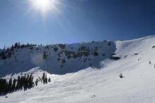 Steep north facing terrain showing a couple old crowns and evidence of wind.