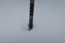 Measuring new snow in a fairly wind protected area: about 22 cms 