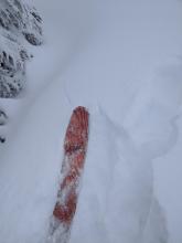 Cracking on a small wind-loaded slope near the ridge