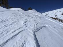 Recent NE winds have scoured most exposed terrain near and above treeline.