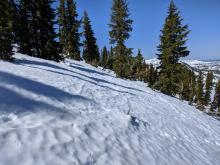 Rough snow surfaces on the northerly aspects of Rubicon Peak.