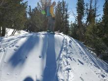 Small test slope that triggered a wind slab to release. Slab that broke off runs from ski tips towards camera. See shooting cracks near back of skis. 