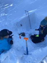  Showing some friends the tests done in a snow profile pit