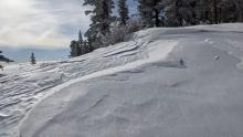 Wind scouring during the storm then winds shifting to NE and starting to blow snow back over to other side.