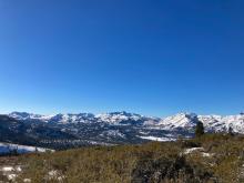 Popping out on the ridge and look to to the south. The north facing slopes in the distance look much more wintery than the dry south facing slope we are standing on top of.