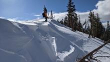 Touchy wind slabs, long cracks also extended ahead of the skier in this photo.