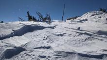 More wind scoured surfaces on NE facing slopes near the summit of Hidden Peak