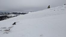 Wind exposed terrain scoured to firm icy rain crusts