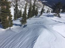 Evidence of recent NE winds redistributing snow along ridgetops.