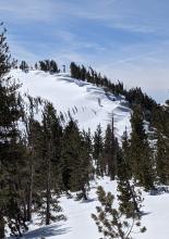 New cornice build out above smooth slopes that had held a rough surface pre storm.