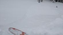 Small wind slab and sluff on a wind-loaded test slope. The left side sluffed and entrained about 12-18 inches of new snow but did not propagate beyond my ski. The right side cracked and propagated anout 20 ft to the right but was only about 6 inches deep on that side.