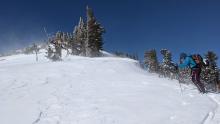 Moderate blowing snow on exposed ridges and peak