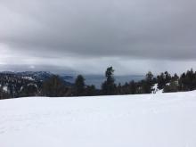 Dark clouds and warm temperatures.