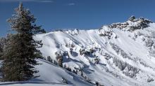 Blowing snow, raised and scoured tracks, and large cornices on the N side of Castle Peak