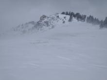 Intense blowing and drifting snow on the ridgetop.