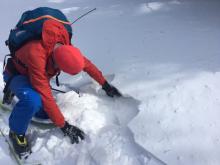 Hard wind packed slab sitting on soft snow. The wind slab was thin here and behaved more like a breakable crust.