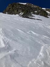 Steep E and NE terrain on Elephants Back at 9400 feet holding firm winter snow.