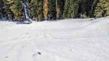 Runnels on the snowpack indicating water draining through the snowpack