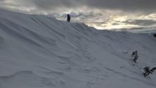 NE winds had scoured areas near the ridgeline.