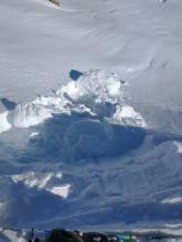 Cornice collapse and snow wet snow entrainment and roller balls.