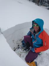 Snowpit location with new snow visible above line and old faceted snow below Rain Crust line.