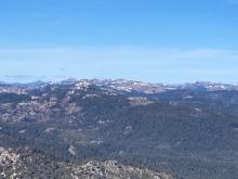 Looking north from near the summit of Rubicon Peak shows mostly bare ground on southerly aspects and lower elevation areas.