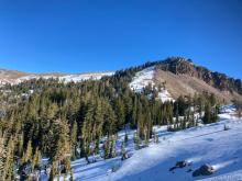 Melted south aspects, snow covered north aspects.