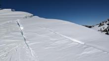 Fissures behind large cornices, an impressive 15 to 20 feet deep.