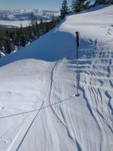 Cornice formation from past SW winds and ridgetop sastrugi from E winds last night.