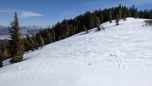 Wind hammered snow surfaces on the ridge.