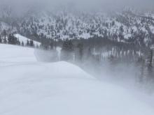 Strong W winds transporting snow along the upper ridgeline forming small wind slabs.