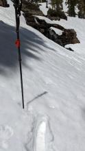 Boot top deep wet snow near a waterfall that has melted out at about 7600 ft on a south aspect.